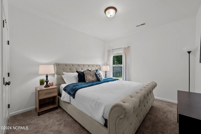 bedroom featuring visible vents, baseboards, and carpet flooring