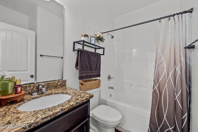 full bathroom featuring vanity, toilet, and shower / tub combo