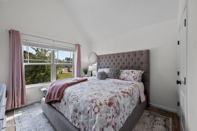 bedroom featuring lofted ceiling, carpet flooring, and baseboards