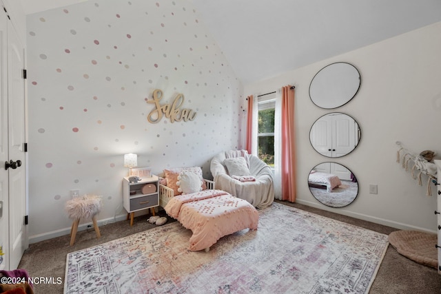 bedroom with lofted ceiling and carpet