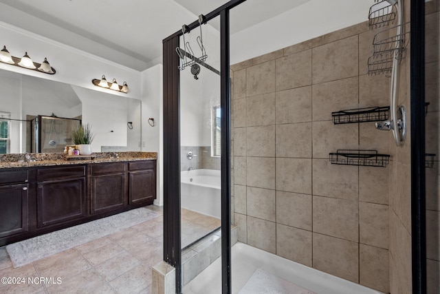 full bath with a bath, a shower stall, tile patterned flooring, and vanity