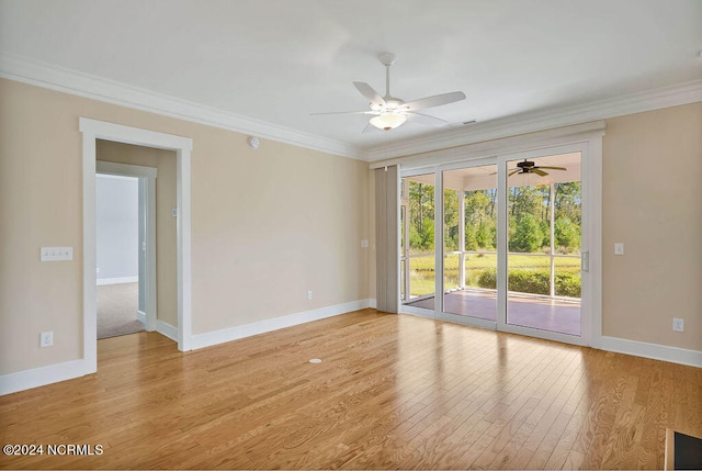 empty room featuring ornamental molding, light wood-type flooring, and ceiling fan