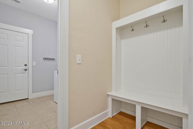 mudroom with light tile patterned flooring