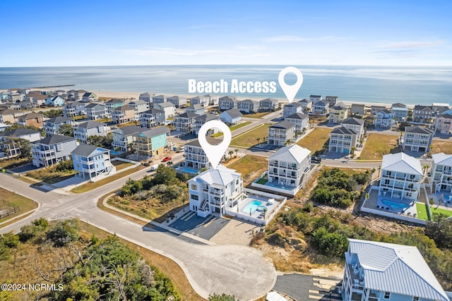 birds eye view of property with a residential view and a water view