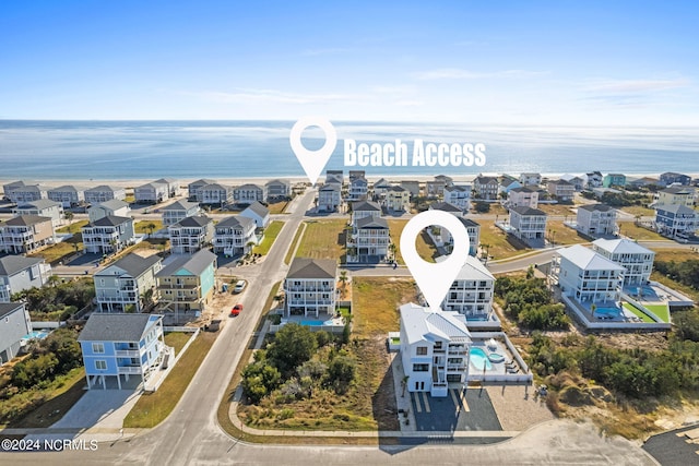 aerial view featuring a water view and a residential view