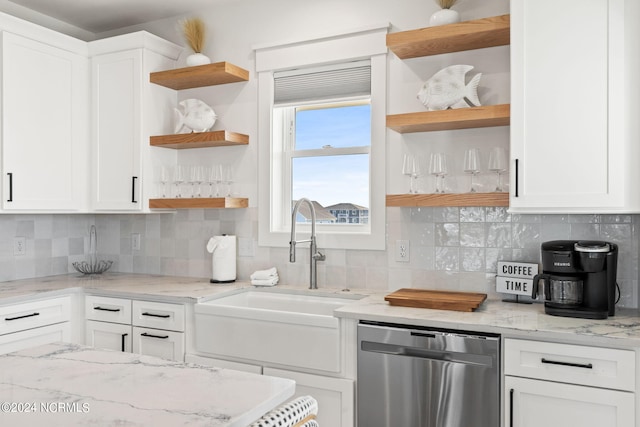 kitchen featuring a sink, white cabinets, open shelves, and stainless steel dishwasher