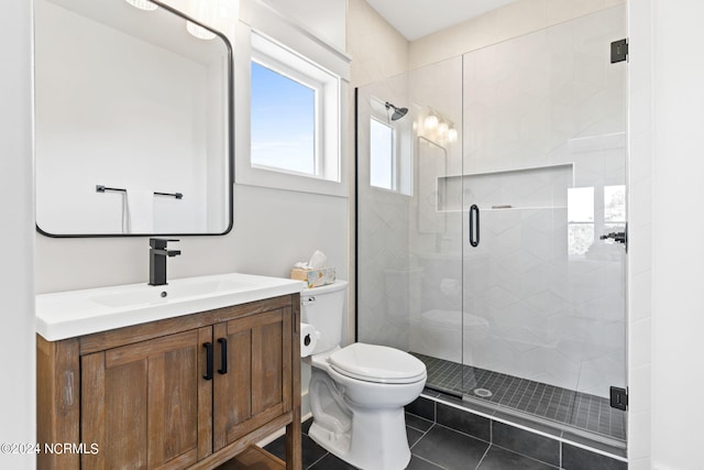 bathroom with toilet, a stall shower, tile patterned flooring, and vanity