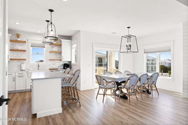 dining room featuring light wood finished floors and a wealth of natural light