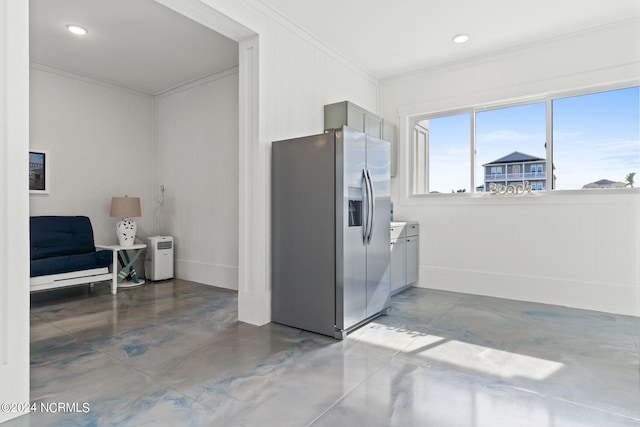 kitchen with gray cabinets, concrete flooring, crown molding, and stainless steel fridge with ice dispenser