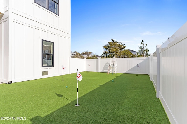 view of yard with a fenced backyard