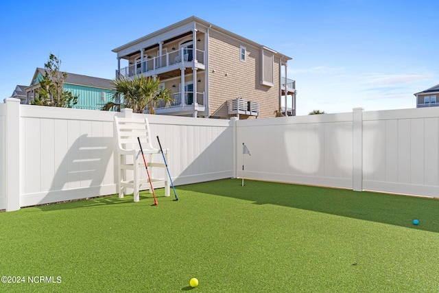 view of yard with a fenced backyard