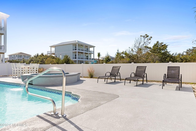 view of pool with a patio, fence, and a fenced in pool