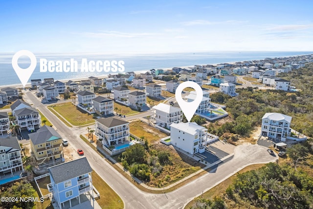 birds eye view of property featuring a water view and a residential view