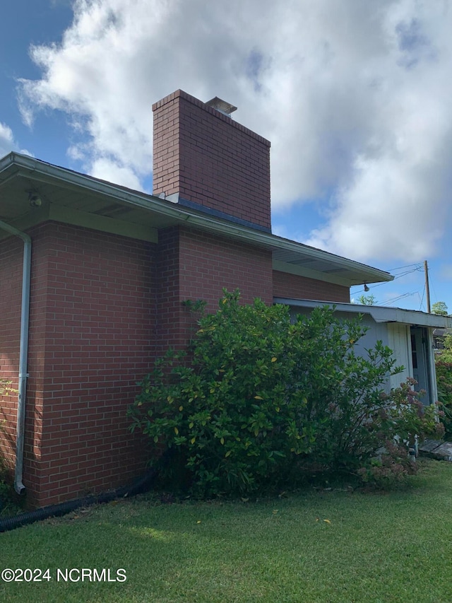 view of home's exterior featuring a lawn