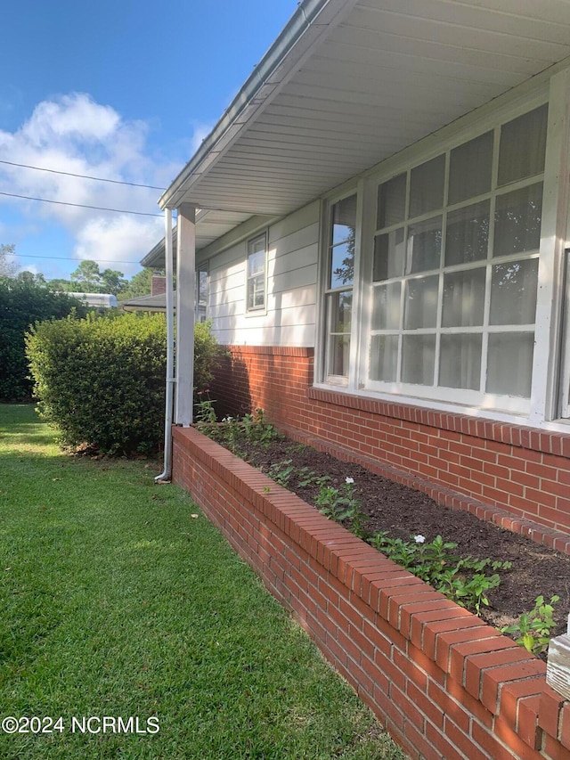 view of home's exterior featuring a yard