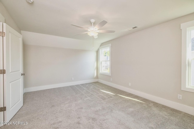 empty room with light carpet and ceiling fan