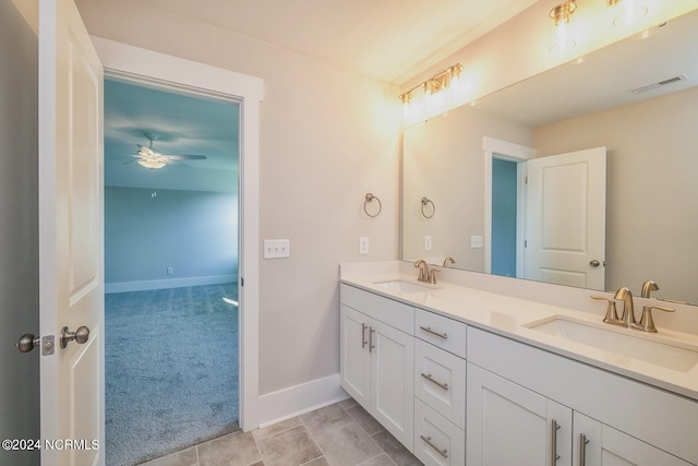 bathroom with tile patterned flooring, ceiling fan, and vanity