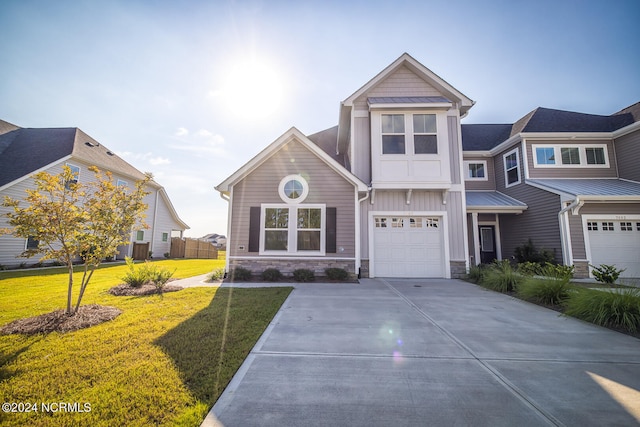 view of front of property featuring a front lawn and a garage