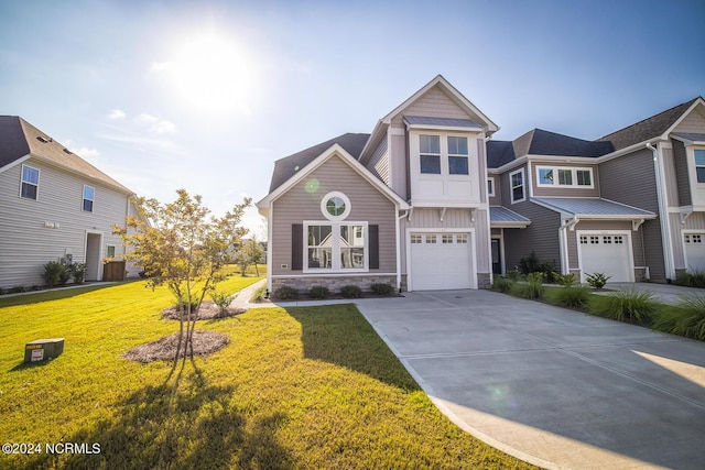 view of front of property featuring a garage and a front lawn