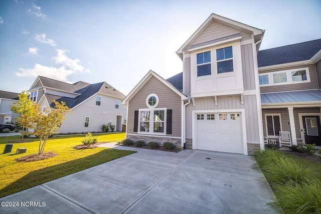 view of front of house featuring a front yard and a garage