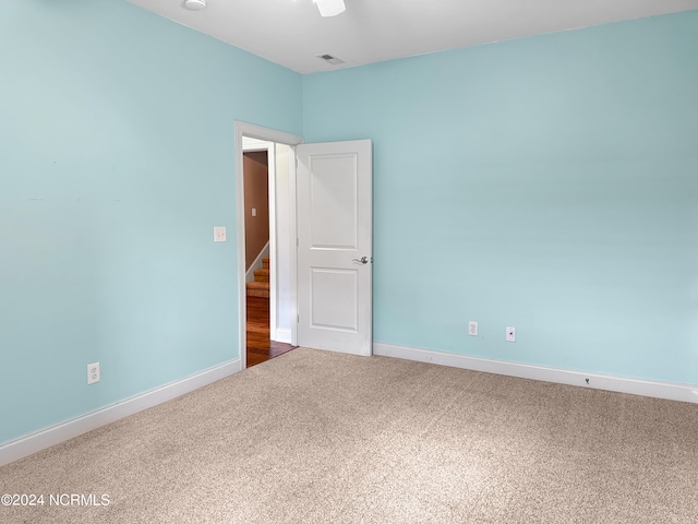 unfurnished room with carpet floors