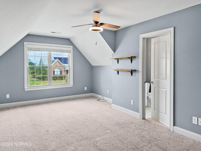 additional living space featuring carpet, ceiling fan, and vaulted ceiling