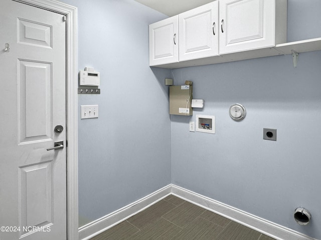 clothes washing area with washer hookup, cabinets, electric dryer hookup, and hookup for a gas dryer