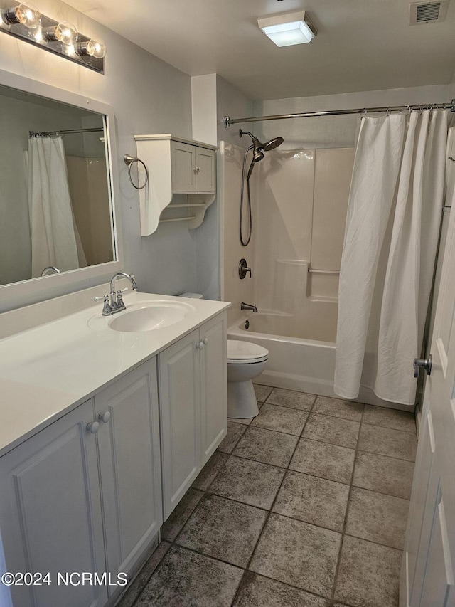 full bath with visible vents, shower / tub combo with curtain, vanity, and toilet