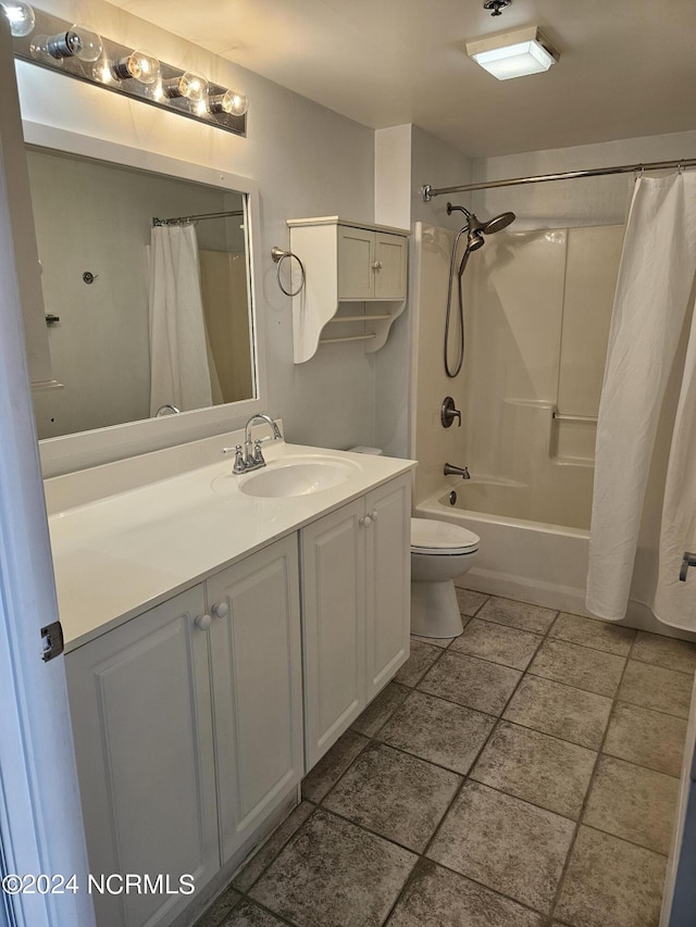 full bath featuring toilet, shower / tub combo with curtain, and vanity