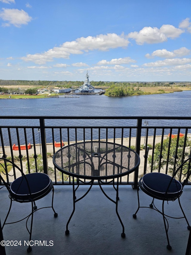 balcony featuring a water view