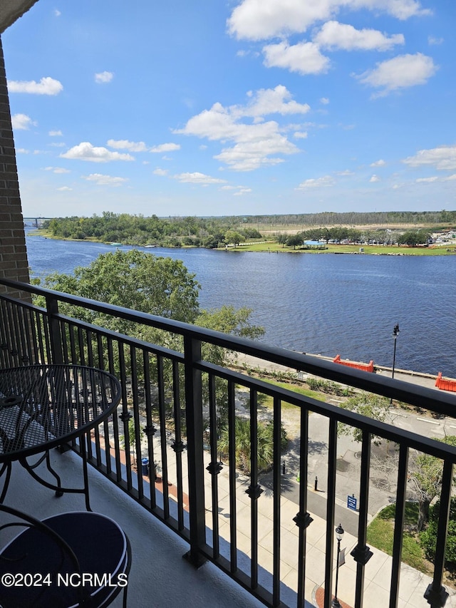 balcony featuring a water view