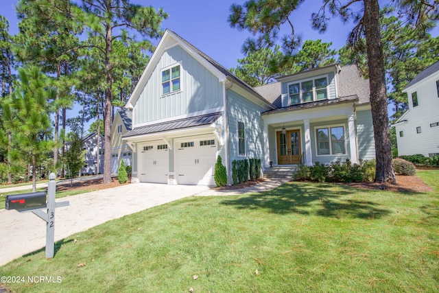 view of front of property with a front yard and a garage