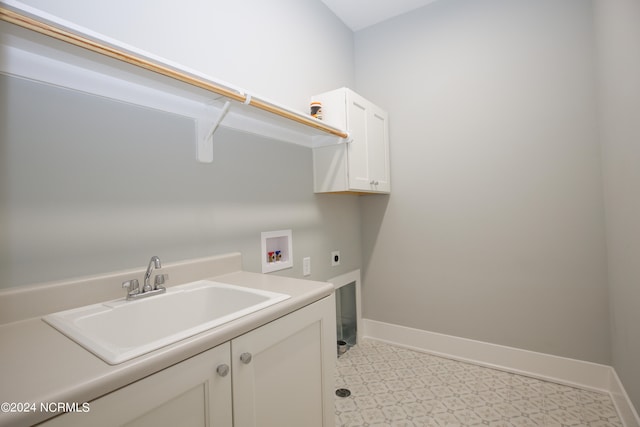 laundry room featuring cabinets, sink, washer hookup, and hookup for an electric dryer