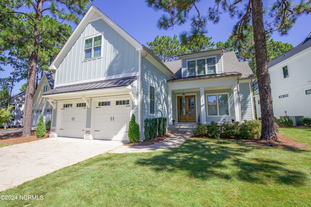 view of front facade with a garage and a front lawn