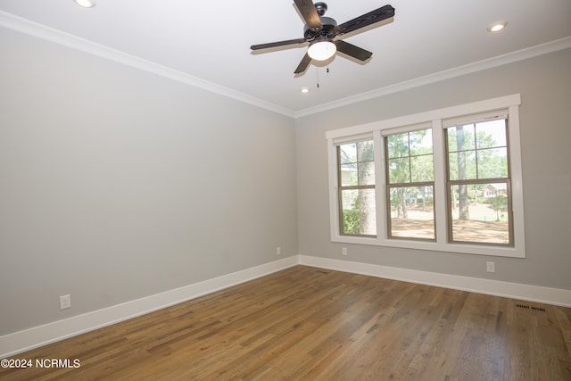 empty room with crown molding, ceiling fan, and hardwood / wood-style flooring