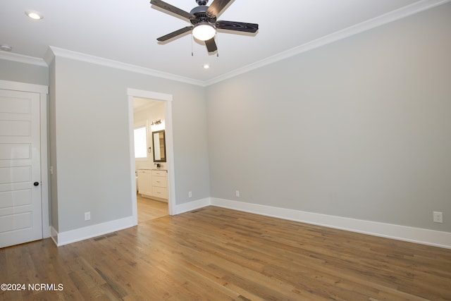 unfurnished bedroom with light wood-type flooring, ceiling fan, ornamental molding, and ensuite bath