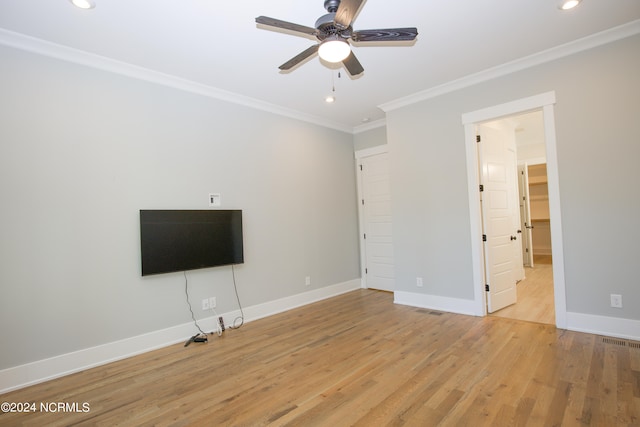 unfurnished living room with ceiling fan, crown molding, and light hardwood / wood-style flooring