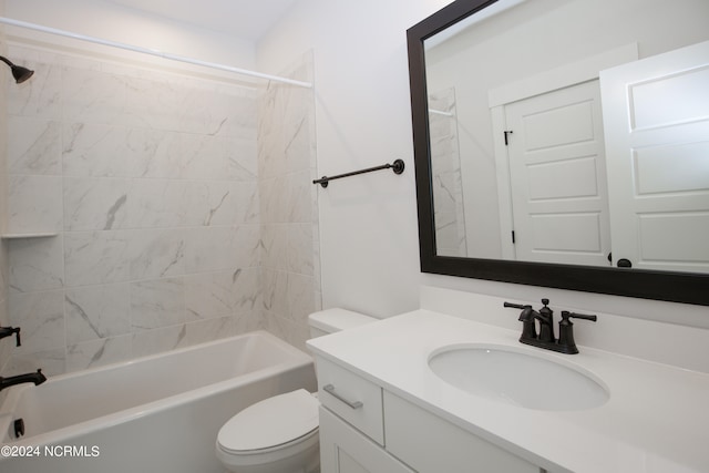 full bathroom with toilet, tiled shower / bath combo, and vanity