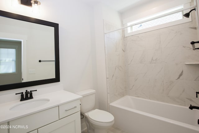 full bathroom featuring vanity, toilet, and tiled shower / bath combo