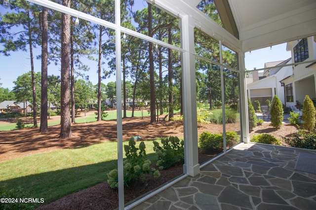 unfurnished sunroom with vaulted ceiling