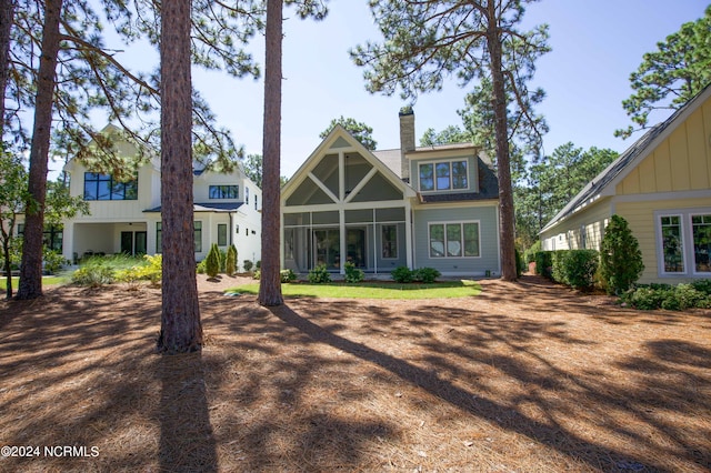 back of house with a sunroom