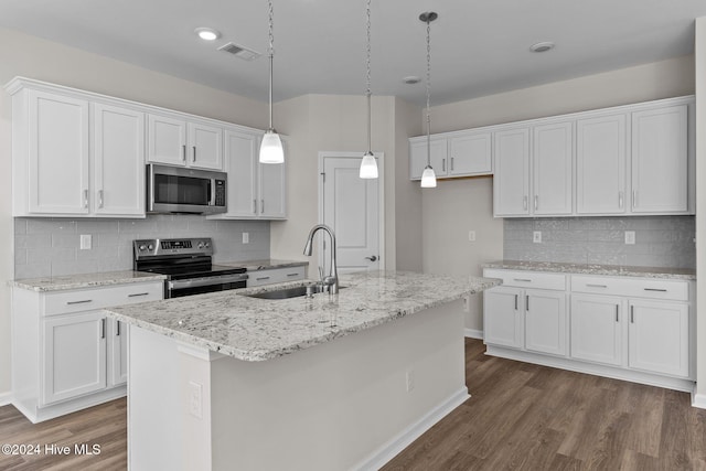 kitchen with white cabinetry, sink, decorative light fixtures, a kitchen island with sink, and appliances with stainless steel finishes