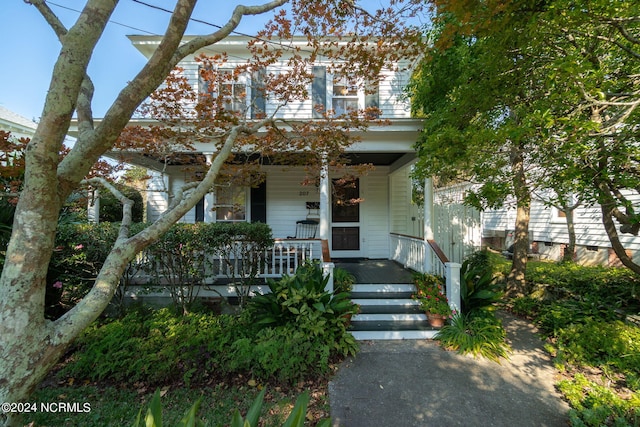 view of front of property featuring covered porch