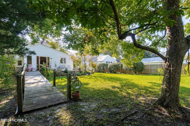 view of yard with a wooden deck