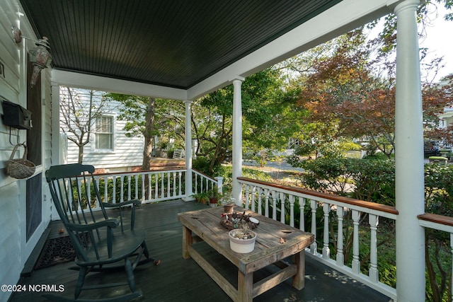 wooden terrace featuring a porch