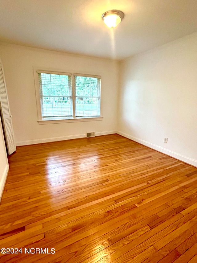 empty room featuring hardwood / wood-style flooring