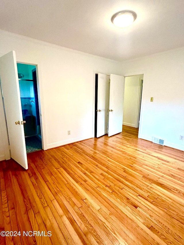 unfurnished bedroom with light hardwood / wood-style flooring