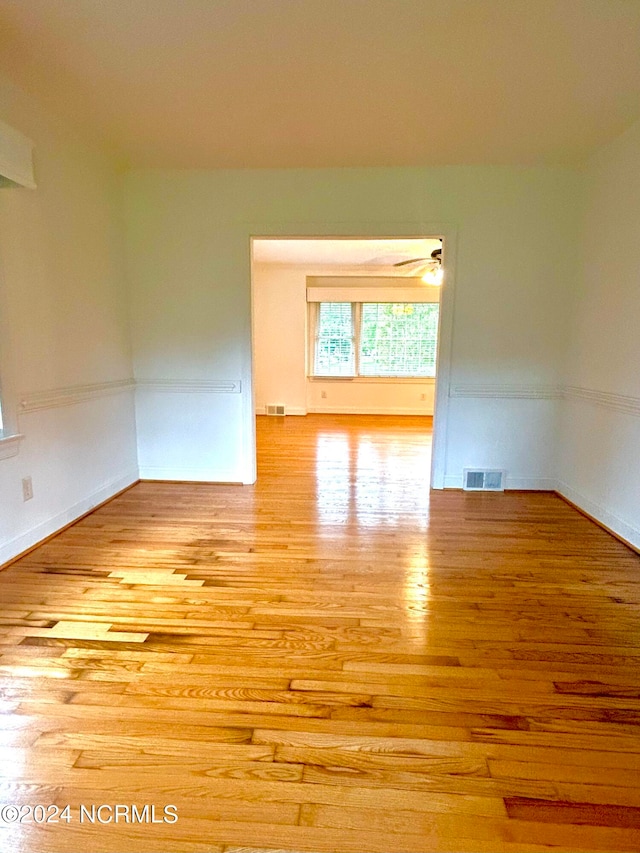 empty room with light hardwood / wood-style flooring