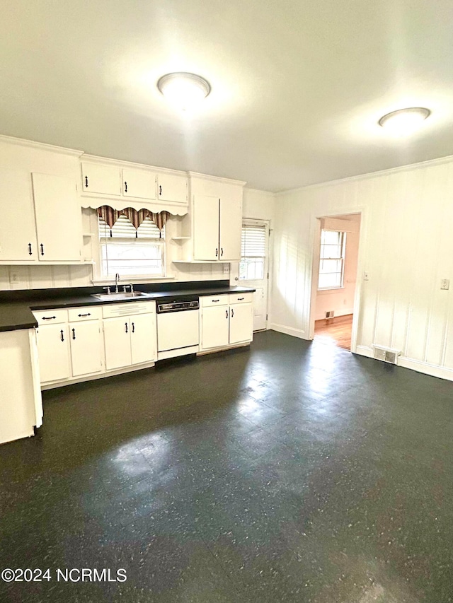 kitchen with dishwasher, ornamental molding, and white cabinetry