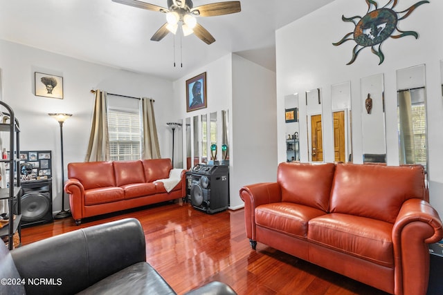 living room featuring hardwood / wood-style floors and ceiling fan